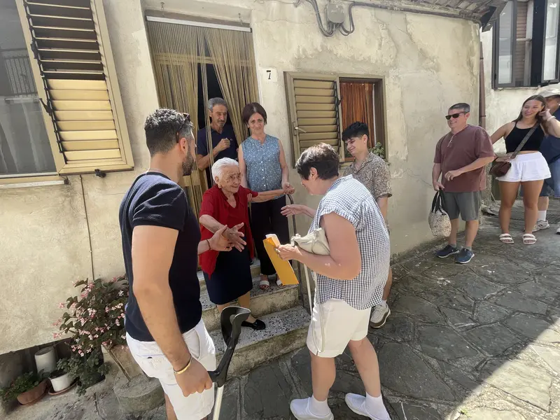 An emotional reunion between Carrie’s mother and her aunt Rosa on the doorstep in Alessandria del Carretto.